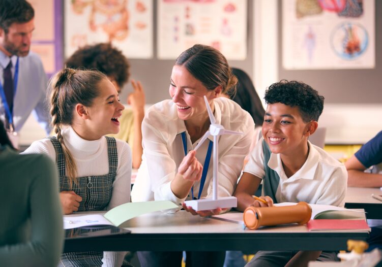 Teacher working with students